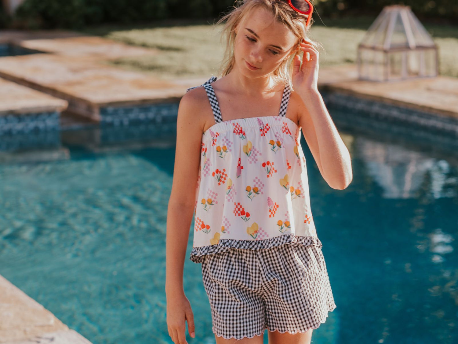 Tween girl on pickleball court wearing Foxtale's Blush Tank and white CLoud Dancer Skort