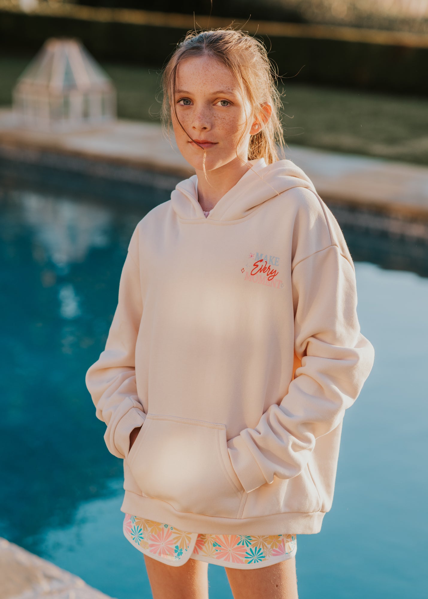 Finding Foxtale girl wearing a cream colored Bestie hoodie
