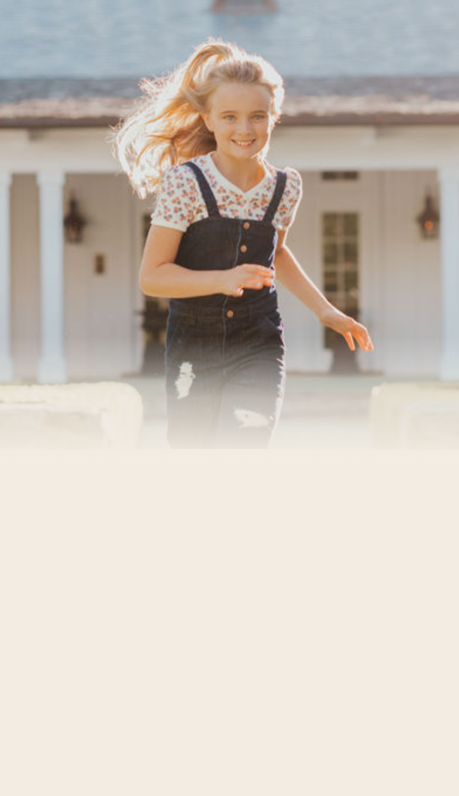 Girl running in Foxtale overalls and floral tee