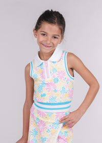 Tween girl wearing a pink, blue and yellow floral zip-front tank top with white collar